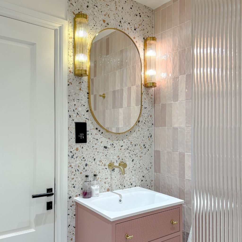 Playful terrazzo and blush-toned modern small bathroom design.
