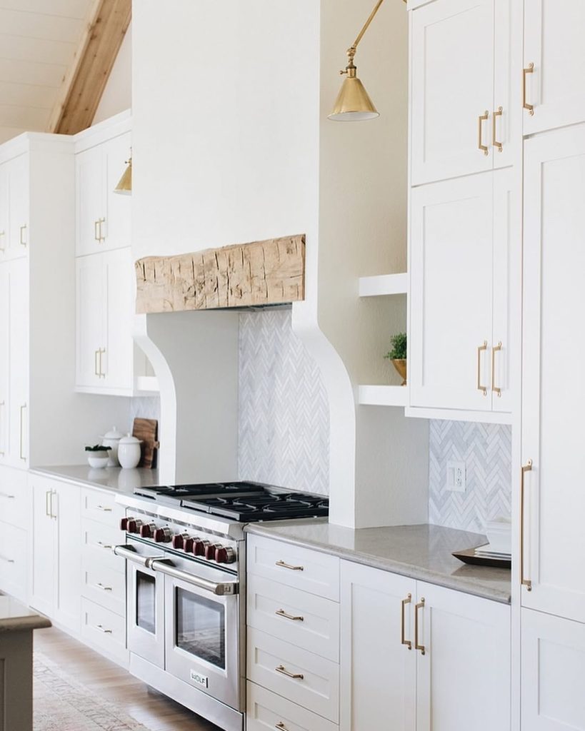 Bright white kitchen cabinets with rustic wood accents and kitchen pantry ideas
