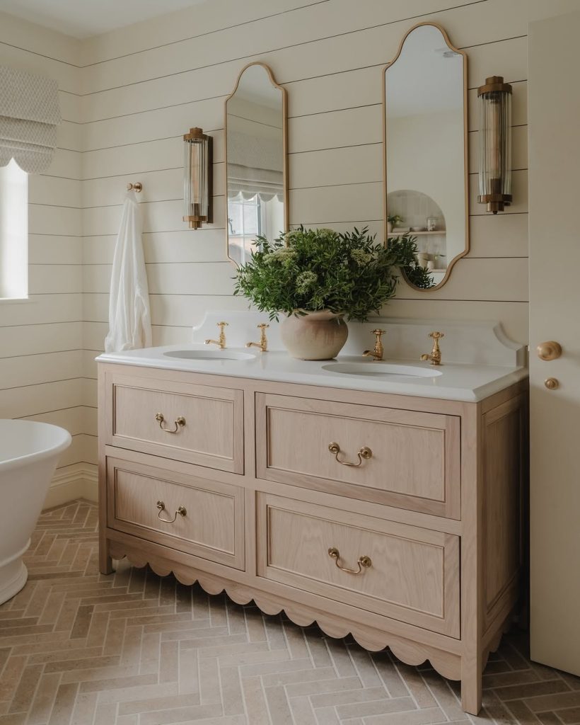 Soft neutral double sink bathroom idea with handcrafted tile and wood vanity.
