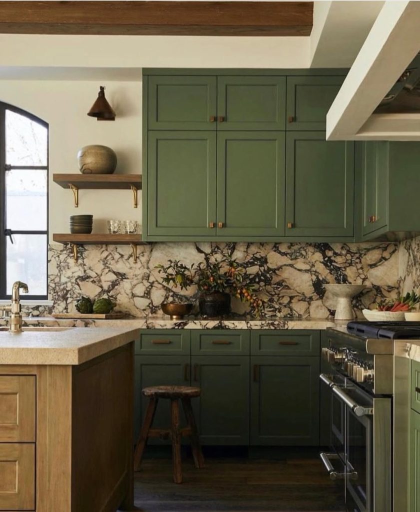 Earthy green kitchen cabinets with bold marble backsplash and pantry ideas
