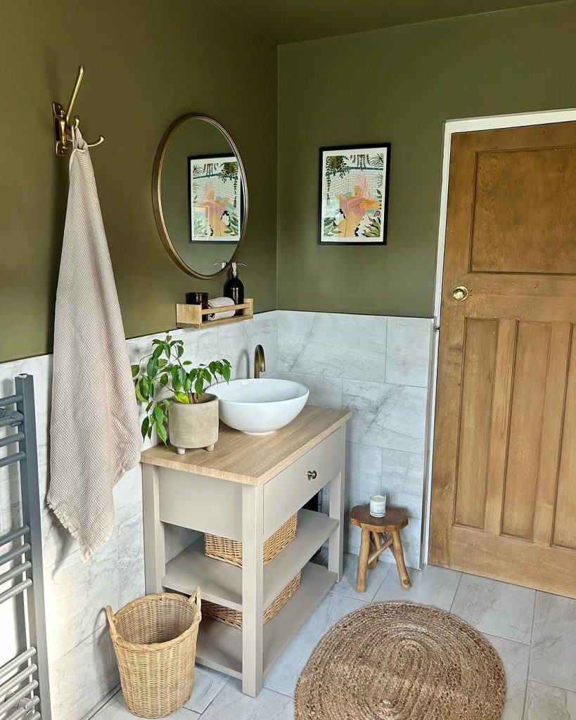 Geometric black and white floor in a vintage-style small bathroom.
