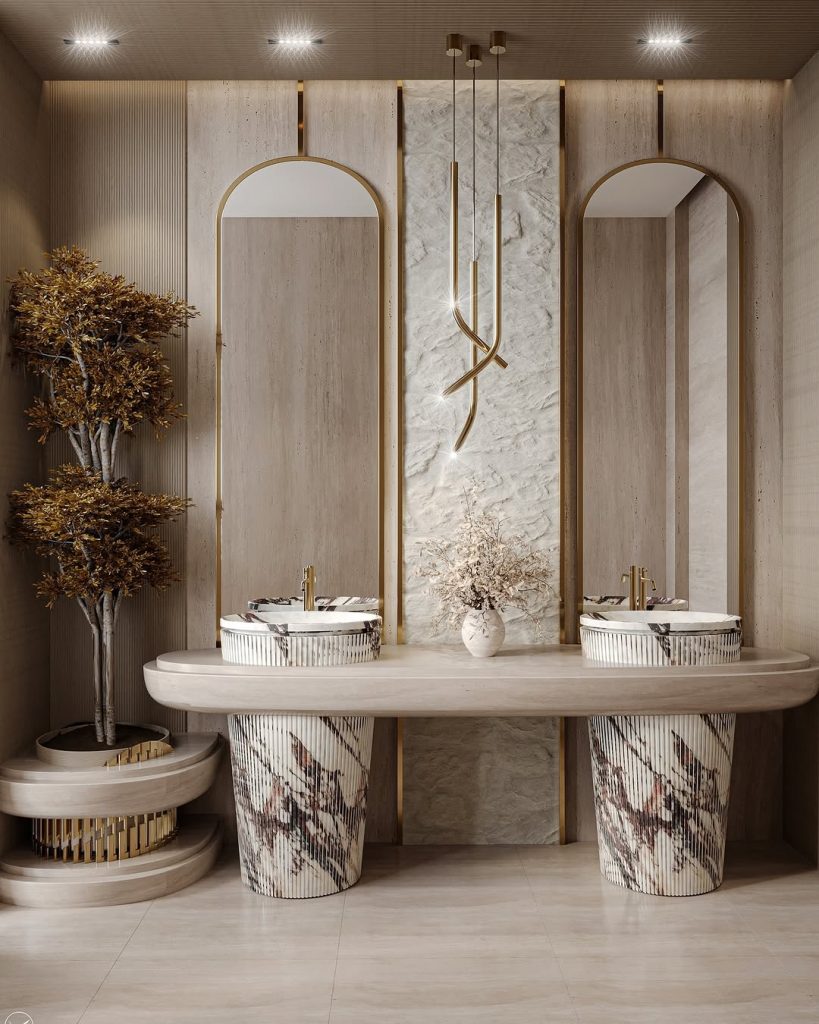 Luxury modern double vanity with sculptural sinks and gold details.
